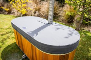 Cover for wood fired bath tub