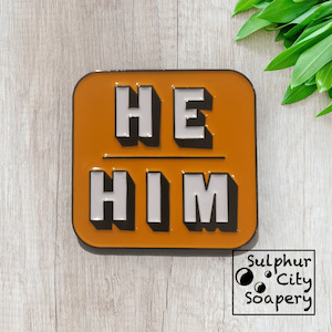 Proud As Punch: He / Him Pronoun Pin - in black and orange