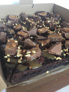 Products: Loaded Snickers Brownie Slab Sweet Cheeks Cakery