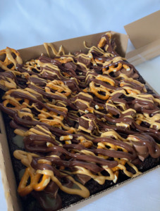 Products: Peanut Butter, Salted Caramel & Pretzel Loaded Brownie Sweet Cheeks Cakery