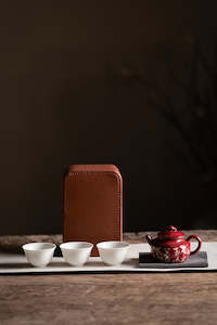 Frontpage: One pot and three cups of leather storage box Kung Fu tea shell portable travel tea set
