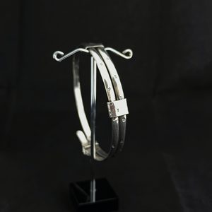 Products: Handmade Sterling Silver Bangle with Tiny Hearts - Sue Woledge – Massage & Contact Care Te Aroha