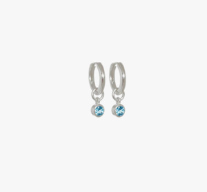 Evolve Earrings: Evolve Sterling Silver December Topaz Huggie Earrings