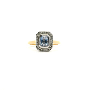 Coloured Stone Engagement Ring: Sapphire & Diamond 18ct Yellow Gold 1.10ct Emerald Cut Ceylonese Sapphire & 0.08ct Round Brilliant Diamond Cluster Ring