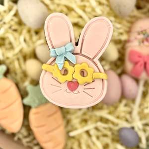 Easter bunny cookie - yellow glases, blue bow
