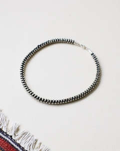 Accessories: Braided silver bracelet