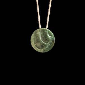Necklaces: Jade disc pendant with korus by Madelyne Gourdin