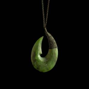 Orphaned: Hei Matau hook, bound handcrafted jade pendant