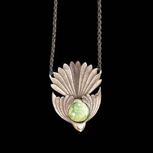 Silver and Jade Pīwakawaka bird pendant by Madelyne Gourdin