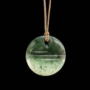 Orphaned: Jade disc pendant by John Kerwin