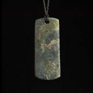 Hand carved Hei Toki jade pendant by Nick and Mady