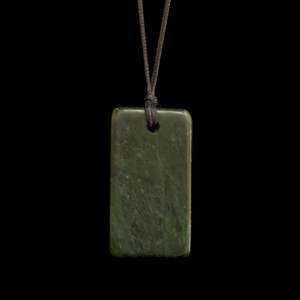 Hand carved Hei Toki jade pendant by Nick and Mady