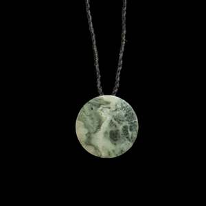 Jade disc pendant by Nick and Mady