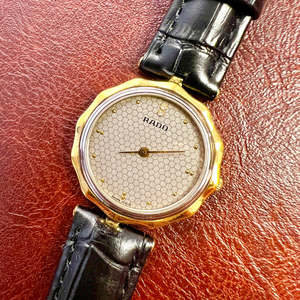 Tiny But Mighty: Rado Two Toned Woman's Watch with a Blooming Case 🌼