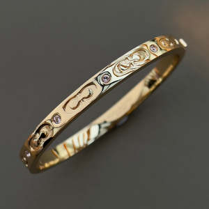 Coach Gold Toned Hinged Bangle with in-laid Crystals