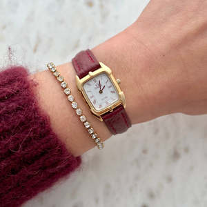 Omega De Ville Gold Women’s Watch with Burgundy Roman Numerals