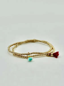 DANE JEWELLERY - PETITE BURGUNDY TASSEL BRACELET - GOLD
