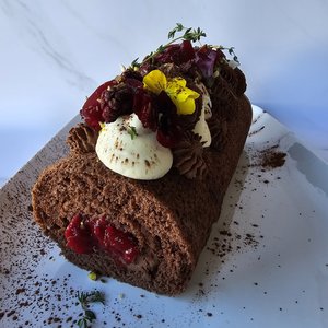 Black Doris plum and chocolate Swiss roll with whipped chocolate ganache