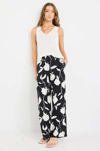 STORIES BE TOLD BENEFICIAL BLACK AND WHITE FLORAL FLAT FRONT ELASTIC BACK PANTS