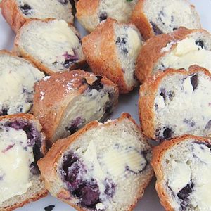 Products: Sweet Scone Half topped with jam and whipped cream