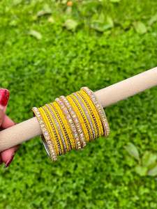 Yellow Colour Jewellery Options: Yellow colour bangles with shiny golden kangan’s ( set of both hands )