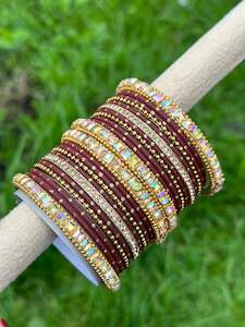 Maroon colour bangles with shiny golden kangan’s ( set of both hands )