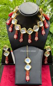 Maroon choker / necklace set in uncut Kundan with tumbler beads