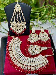 C Red Colour Jewellery Options: Pearl loaded necklace set with passa in Kundan in red colour