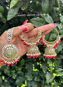 C Red Colour Jewellery Options: Red waliya earrings with Tikka in mirror