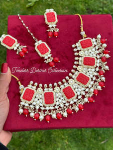 C Red Colour Jewellery Options: Red choker / necklace set in Kundan with curving stone