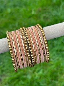 Peach velvet bangles set with golden beaded kangan’s