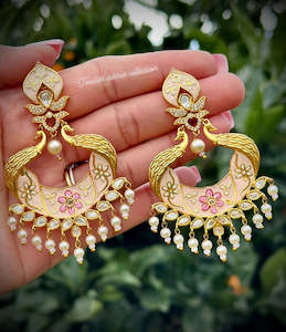 Gold plated creamish golden earrings in reverse AD ( high quality )