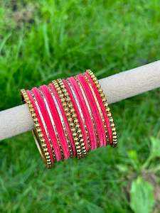 C Hot Pink Colour Jewellery Options: Carrot pink velvet bangles set with golden beaded kangan’s