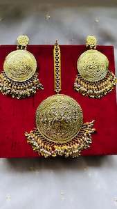 Golden earrings with oversized tikka in Punjabi traditional jewellery