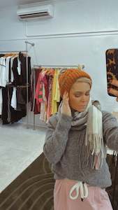 Accessories: Burnt orange knit Pom Pom beanie