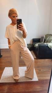 All Pants: Refuge Beige Wide Leg Trousers With Tuck Detail Front