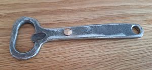 Bottle opener with rivet detail