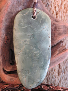 Products: Chatoyant Blue Kokopu Niho Pendant Woven Stone Jade