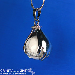 Sphere Pendants: Hand and Howlite Sphere Pendant