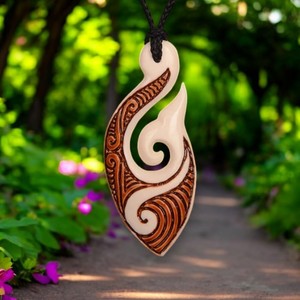 Bone Carvings: Stained Bone Carved Pendant with Tail