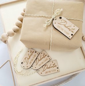 Set of personalised Christmas gift tags, all tags engraved with child's name. Wa&hellip;